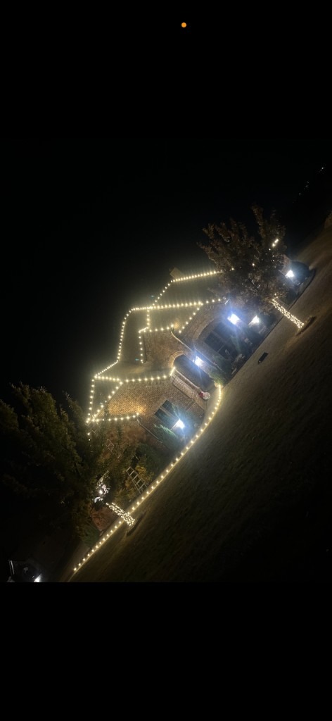 Multi-color peaks with warm uplights on stone