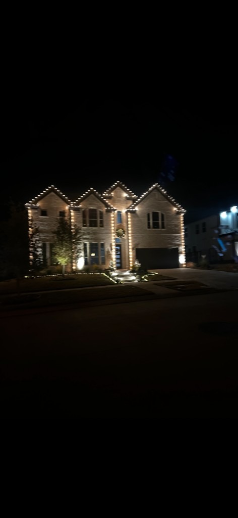 Warm white full-house outline lighting at night